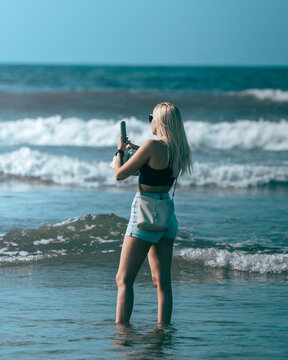 Beautiful Russian girl at the beach during summer