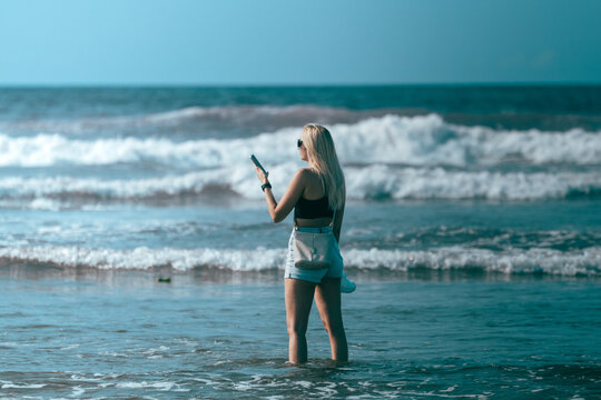 Beautiful Russian girl at the beach during summer
