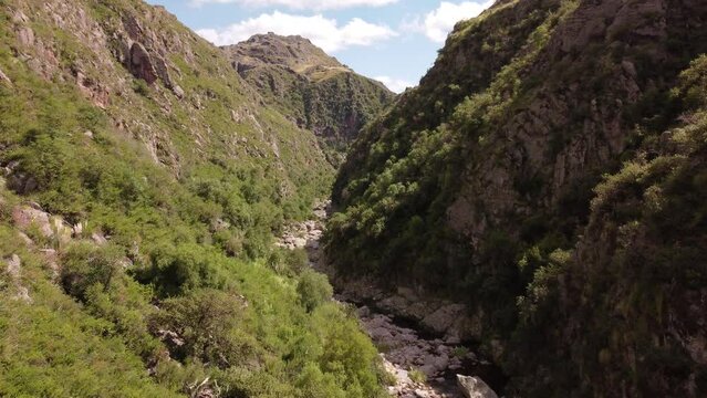 drone flying in the valley, between canyon cliffs in copina Cordoba