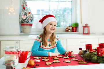 Kids bake Christmas cookies. Child cook for Xmas.