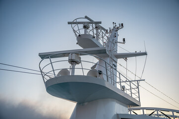 Cruise ship radar tower bridge in the evening, low angle view