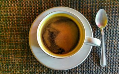 Cup of americano black coffee in restaurant cafe in Mexico.