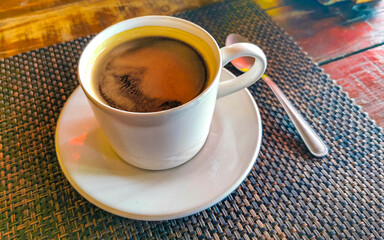 Cup of americano black coffee in restaurant cafe in Mexico.