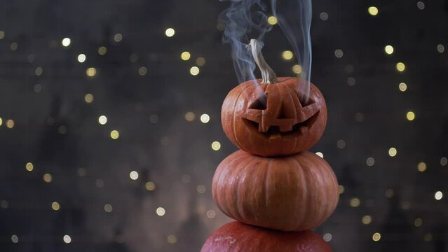 Halloween pumpkin piramid with smoke rising from eyes 