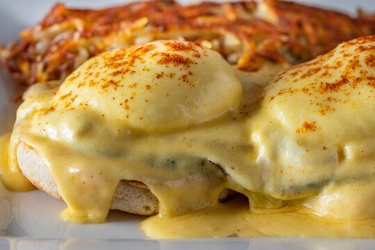 Closeup of eggs benedict with hash browns