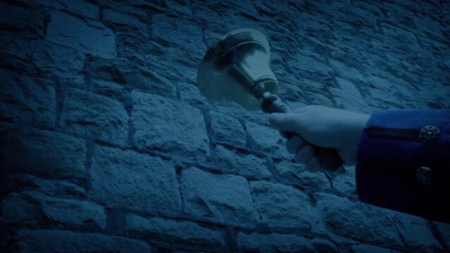 Man Rings Hand Bell By Building In The Dark Historic Dress