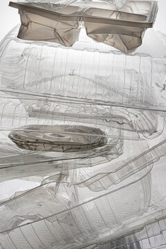 Backlit stack of clear food containers