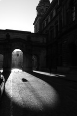 United Kingdom, Glasgow - City of Glasgow in the UK. Bright sunny day, play of light and shadow, illuminated historical part of the city. A cozy old building, the historical heritage of the city