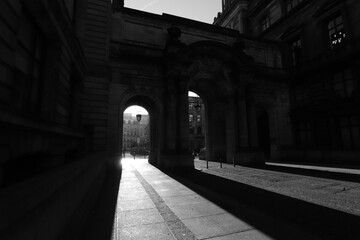 United Kingdom, Glasgow - Jan ‎2023: Black and white photograph of the city of Glasgow in the UK. Bright sunny day, play of light and shadow, illuminated historical part of the city. historical 