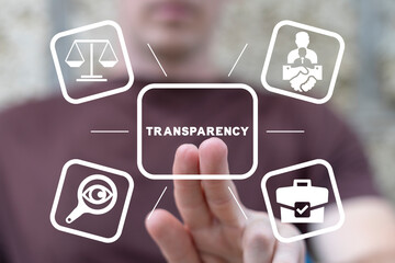 Man using virtual touchscreen clicks word: TRANSPARENCY. Business transparency concept. Honest and...