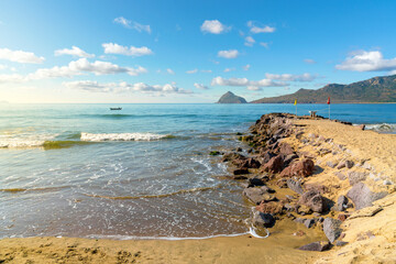 Late afternoon view from beach and rocky coastline at the Zona Dorado or Golden Zone along the Mexican Riviera at Mazatlan, Mexico. 