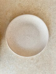 a shallow plate is on the table