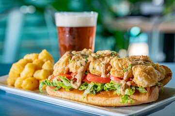 Shrimp Po Boy Sandwich with Lettuce and Tomato. - obrazy, fototapety, plakaty