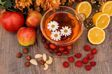 Obraz na płótnie Canvas Vitamin fruit tea made from rosehip and lemons. Prevention of influenza