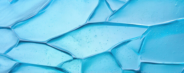 Closeup of a crackled fused glass piece, showing a mix of jagged and smooth edges with a frosted, textured surface.