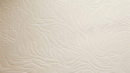 Fototapeta premium Closeup of embossed handmade paper The surface of this paper is adorned with raised designs, giving it a threedimensional and elegant look. Its smooth texture hints at its high quality.