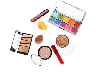 Flying set of makeup cosmetics on white background
