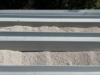 Double-T steel beams for landscape retainer walls