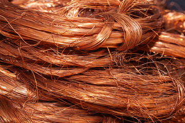Scrap copper stripped cables twisted and collected in a heap, close-up. - obrazy, fototapety, plakaty