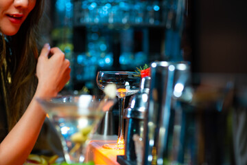 Portrait of Attractive Asian woman relax and enjoy hangout nightlife and drinking fancy cocktail at...