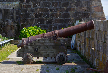 medieval cannon placed on defensive wall in the castle of San Anton de A Coruna, Spain