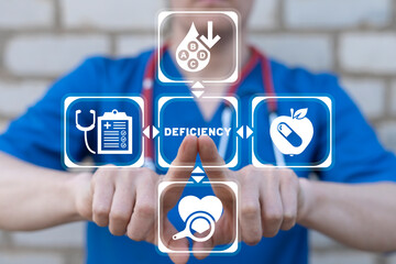 Doctor using virtual touchscreen presses word: DEFICIENCY. Deficiency medicine concept. Vitamin...
