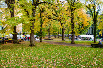 Vendors at the portland farmers market in downtown portland, or with vibrant fall color