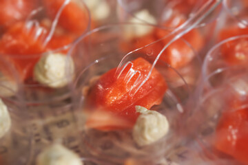 Catering table, beautifully decorated banquet with variety of with different food snacks appetizers on corporate birthday party event or wedding celebration, canape, salad, delicatessen setting