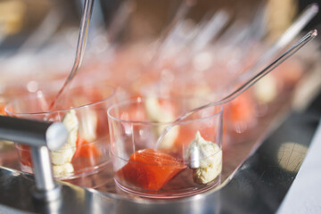 Catering table, beautifully decorated banquet with variety of with different food snacks appetizers on corporate birthday party event or wedding celebration, canape, salad, delicatessen setting