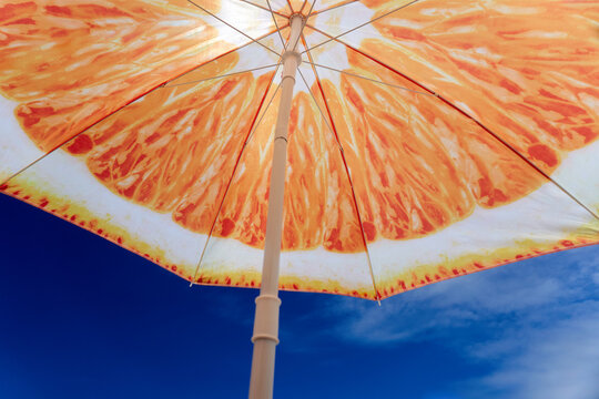 Orange Serenity: Relaxation under a Patterned Umbrella