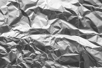 Shiny metal silver gray foil crumpled texture background
