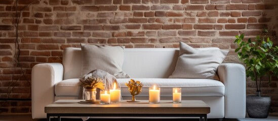 White living room with beige couch and brick wall metal coffee table with candles With copyspace...