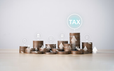 Tax icon on stacked coins to complete Individual income tax forms online for tax payment....