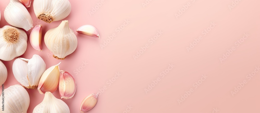 Aufkleber Raw garlic cloves isolated on a isolated pastel background Copy space with clipping path