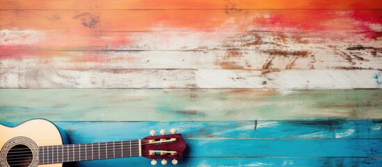 Musical notes on colorful wood with guitar neck - obrazy, fototapety, plakaty