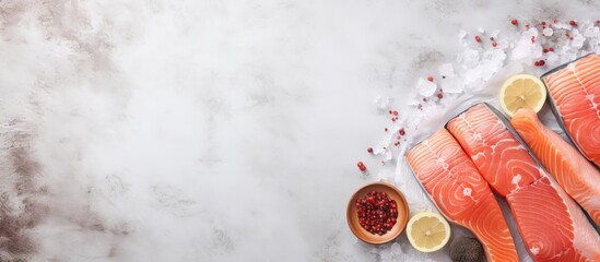 Salted and peppered raw salmon prepared for cooking isolated pastel background Copy space