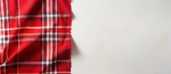 Obraz premium Top view of isolated pastel background Copy space with red and white scotch pattern fabric and available space for text Textured background concept