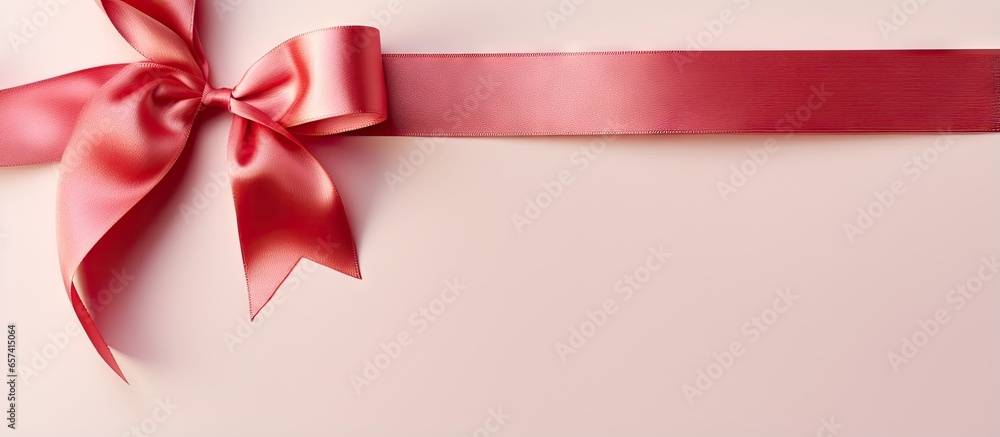 Fototapete copy space image on isolated background with shiny red ribbon