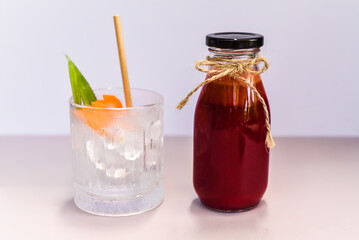 Healthy mixed juice made of carrot, orange fruit, pink dragon fruit, apple with glass with ice