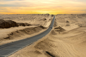 a long road in sand desert