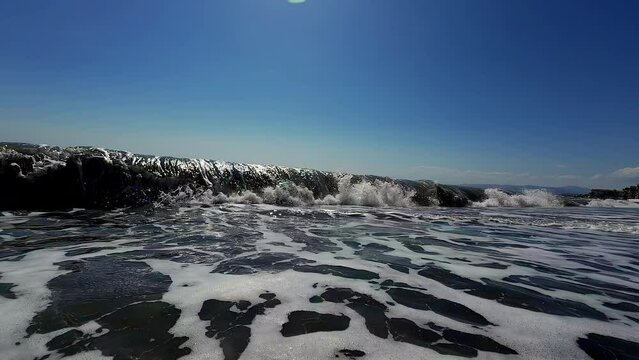 Exotic wave crashing on sunny day, close up view