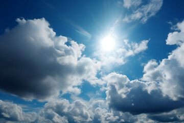 Naklejka na ściany i meble Blue sky background with tiny clouds and sun. Natural sky background.