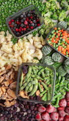 A set of foods for the winter. Various of frozen vegetables and berries