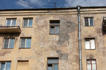 Fototapeta na wymiar Windows on the wall of an old house