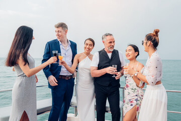 Happy man make surprise proposal of marriage to girlfriend on Yacht. Attractive romantic male...