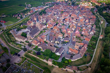 Aerial view above the beautiful French village of Bergheim and its surrounding vineyards - Alsace, France