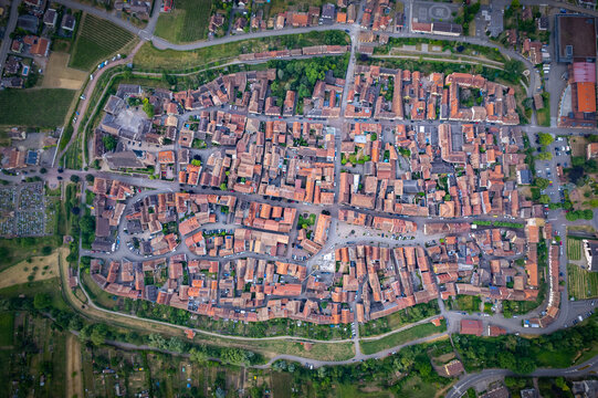 Aerial view above the beautiful French village of Bergheim and its surrounding vineyards - Alsace, France
