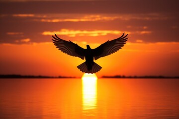 silhouette of a dove flying across a sunrise