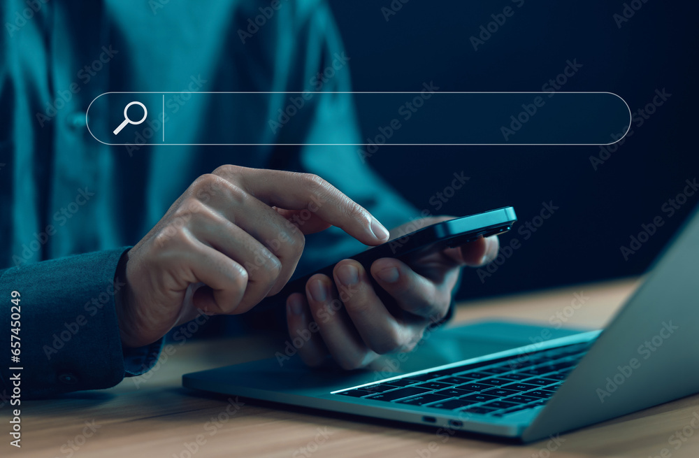 Wall mural businessman using a phone, show search bar. concept of a website to find a job and career on the int