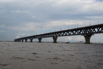 Most extensive Padma bridge photography under the dark cloudy sky
